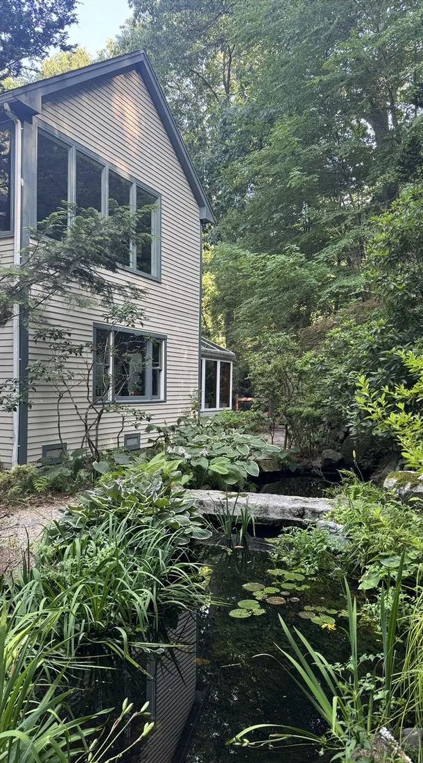 The house seen from across its garden pond